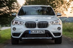 2019 BMW X1 xDrive28i in Alpine White - Driving Frontal View